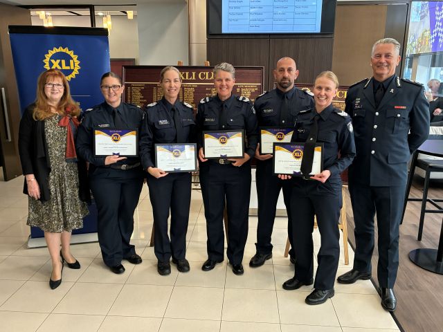 A group of firefigete police officers standing in front of a large display board.
AI-generated content may be incorrect.